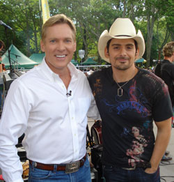 rista Nashville superstar Brad Paisley is this weeks champion on the sales chart with the #1 debut of his new album, American Saturday Night.  Here, Paisley is pictured with Good Morning Americas Sam Champion when Brad was in New York on Friday to play GMAs Summer Concert Series.  Brad follows the three-week #1 success of American Saturday Nights first smash, Then, with his new single, Welcome to the Future, officially impacting radio on Monday.