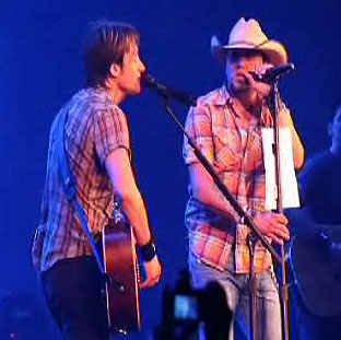 When country music superstar Keith Urban asked both Dierks Bentley and Jason Aldean to join him on stage for the 1975 Eagles hit "Take It To The Limit" at two separate tour dates in VA and KS, he wasn't prepared for his opening acts to have to think on their feet. Each secretly devised last-minute "cheat sheets" to help them with the song that neither had previously performed live. Bentley scribbled out the lyrics on his forearm with a Sharpie, and Aldean followed by taping the printed lyrics sheet to his mic stand with gaffe tape. Once he realized what both acts were up to, Urban didn't let either get away without a little public humiliation in front of both sold out crowds. Thankfully, the fans were more than happy to come to both Bentley and Aldean's rescue, creating an arena-wide sing-a-long.   For video clips of both, visit http://www.keithurban.net/?em5004=194014_-1__0_~0_-1_7_2009_0_0&content=from_the_road_blog 