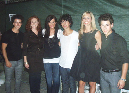 Disney Music Group labelmates SHeDAISY and The Jonas Brothers headlined the Stadium of Fire 4th of July celebration at LaVell Edwards Stadium in Provo, Utah. Pictured backstage (L-R): Kevin Jonas, Kelsi Osborn, Kassidy Osborn, Joe Jonas, Kristyn Osborn, Nick Jonas