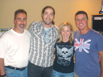  Columbia Nashville newcomer Josh Thompson hangs out with the KBEQ Morning Drive crew while promoting his debut single, "Beer On The Table." Pictured (l-r):  KBEQ's Zeke Montana, Thompson, Natalie Puhr, and PD Mike Kennedy.  