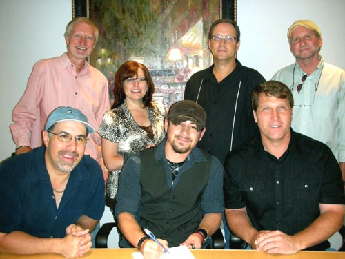 Pictured l to r seated: Jimmy Nichols, president, BRMG, Ty Williams, Gratton Stephens, president/ceo Cherry Heart Music  Standing: Rick Baumgartner, vp/gm BRMG, Tonya Ginnetti, vp/director of artist relations, BRMG, Shelby Kennedy, svp/coo, Cherry Heart Music & co-producer and James Hudson, co-producer.   