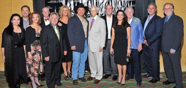 Honorary Chairs Crystal Gayle and Steve Wariner, Leadership Music executive director Kira Florita, Leadership Music board president Pat Collins, tribute performer John Conlee, Honorary Chair Trisha Yearwood, Garth Brooks, Jim Foglesong, Allen Reynolds, tribute performer Martina McBride, Honorary Chair Cowboy Jack Clement, speaker John McBride, and LMDFA tribute show producer Garth Fundis.   Photo credit:  Steve Lowry 