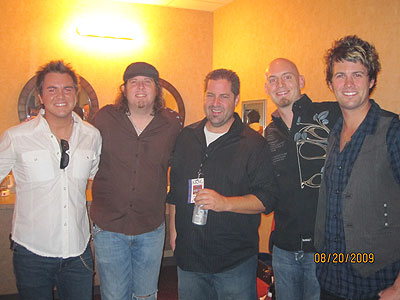 Morning show host Bill Thomas with the Eli Young Band