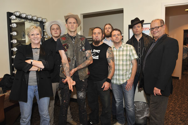 Pictured L-RExhibit co-curator Carolyn Tate, Daniel Mason (banjo), Williams, Shawn McWilliams (drums), Zach Shedd (bass), Adam McOwen (fiddle), Andy Gibson (steel guitar, dobro) and exhibit co-curator Michael McCall. Photo by Donn Jones