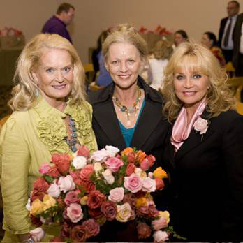 Pictured L to Right: Lynn Anderson, Pat Bullard and Barbara Mandrell stop to smell the roses at a luncheon hosted by Mandrell after Wednesdays dedication of the Nashville Music Garden. (Photo by Katherine Bomboy)