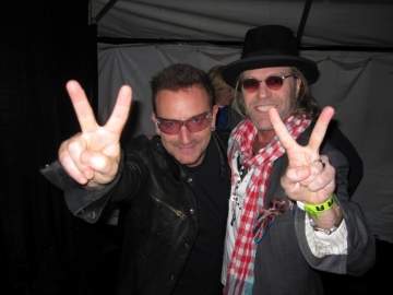   Big Kenny met U2's Bono at a concert stop in Norman, Oklahoma, on October 18. The two were introduced by a mutual friend due to their similar philanthropic passions.