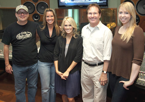  Superstar Carrie Underwood is red-hot on the airwaves with her smash, Cowboy Casanova, and shes pictured here in the recording studio recently at work on her third album, Play On, set for release on November 3. Pictured (l-r): Album producer Mark Bright; Sony Music Nashville A&R Exec VP Renee Bell; Underwood; Sony Music Nashville Exec VP Butch Waugh; and 19 Entertainments Ann Edelblute. Photo Credit: Chris Hollo