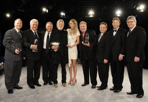 The nights big winners at the 2009 BMI Country Awards in Nashville. (L-R): Troy Tomlinson, Pres./CEO Sony ATV Music Publishing Nashville; Martin Bandier, Chairman/CEO, Sony/ATV Music Publishing LLC; Del Bryant, BMI Pres./CEO; 2009 BMI Icon Kris Kristofferson; Song of the Year honoree Taylor Swift; Songwriter of the Year Bobby Pinson; Jody Williams, BMI VP Writer/Publisher Relations Nashville; Clay Bradley, BMI Asst. VP Writer/Publisher Relations Nashville; and Phil Graham, BMI Sr. VP Writer/Publisher Relations. Photo: John Russell