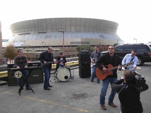 Pictured L-R are Joe Rogers - keys, Derek George - guitar, Travis Thibodeaux (co-writer of “The Who Dat Roll”) - drums, Dave Guidry - bass, Steve Williams – vocals, and Charlie Hutto on guitar.