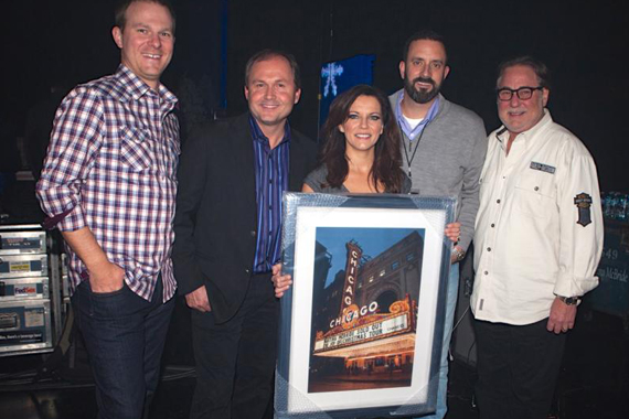 Martina McBride is presented with a plaque depicting a photo of her sold-out concert at the Chicago Theatre. Pictured with McBride (c.) are (l. to r.) Brandon Gill, Morris Artists Management; Don Kronberg, President of NiteLite Promotions; Mike Betterton, Morris Artists Management; Rod Essig, CAA. Photo: RKN Photo