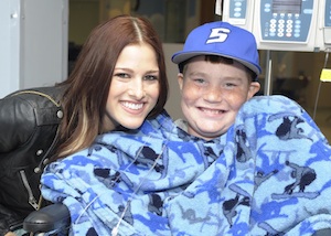 The Voice winner Cassadee Pope visits with a St. Jude patient.