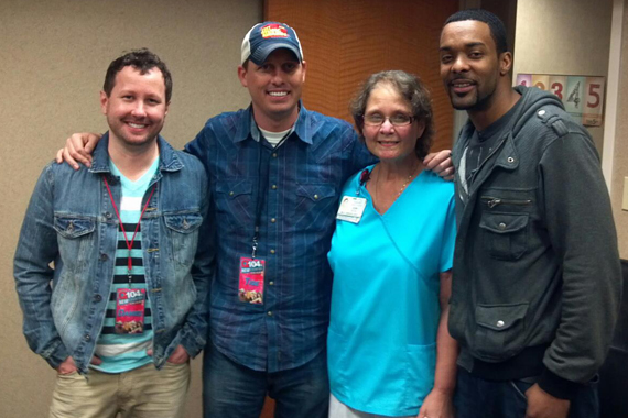 The Farm recently embarked on a random acts of kindness day with 104.1/WTQR. The group visited with Joan, whose husband is fighting with cancer, and provided her with $500 to help with expenses. The Farm's single "Be Grateful" lands On Deck this week. Pictured (L-R) Daniel Baker, Tige Rodgers, Joan, and Damien