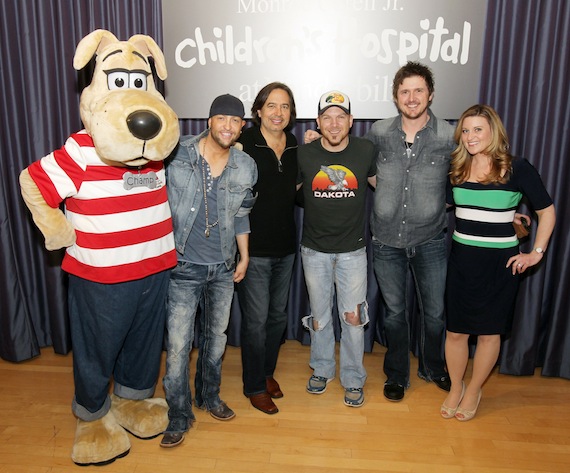 Pictured L-R: Vanderbilt Children's Hospital Mascot Champ, Preston Brust, James Slater, Chris Lucas, Jason Duggins and MCTI Celebrity Host Kelly Sutton. Photo: Steve Green