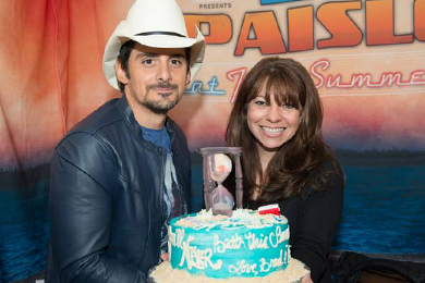 WKLB  Boston celebrated its 20th Birthday with Brad Paisley and The Henningsens on the Beat This Summer tour this past weekend where music director, Ginny Rogers was presented with a cake.  (cake say Happy 20thBirthday, Youll never Beat This Summer! Love, Brad and The Henningsens)