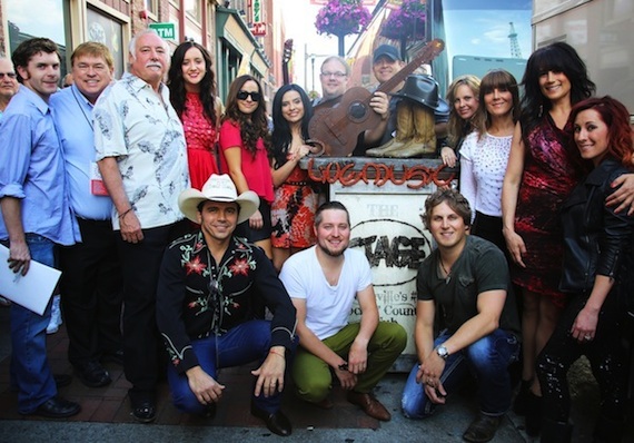 Pictured (L to R): Matt Watkins (AristoMedia), Jeff Walker (AristoMedia, President/CEO), Steve Moore (CMA, CEO), Kaylee Bell (New Zealand), Baylou (Australia), Richard Smith (UK), David Bradley (UK), Natalie Howard (Australia), Michelle Wright (Canada), Jill Johnson (Sweden), Amanda Wilkinson (Small Town Pistols  Canada) Kneeling L to R: Rodrigo Haddad (Brazil), Tyler Wilkinson (Small Town Pistols  Canada), Jason Blaine (Canada). 