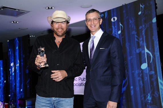 PHOTO CUTLINE: NMPA President and CEO David Israelite presents Toby Keith with the 2013 Songwriter Icon Award