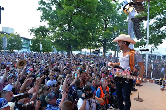 Justin Moore gets an enthusiastic crowd response during his performance at the Brickyard 400.