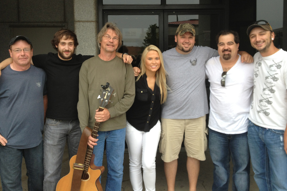 Rachel Holder recently visited with MusicRow Chart Reporter Toby Tucker at WDZQ in Decatur, IL on the way to her show at Fuddfest in Deerbrook, WI. Pictured (L-R) Greg Rudder, Chris Potocik, Stuart Weed, Rachel Holder, Toby Tucker, Kevin Moore and Mike Barnes.