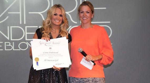 Pictured (L-R): BMIs Associate Director of Writer/Publisher Relations Leslie Roberts with Carrie Underwood. Photo: Chris Hollo