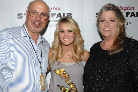 Carrie Underwood recently played Puyallups Washington State Fair where she visited with KKWF Seattle PD Mike Preston and his wife Terri. Pictured (L-R): Preston, Underwood, Yankovich