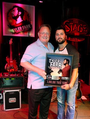 Pictured (L-R): Sony Music Nashville Chairman and CEO Gary Overton and Columbia Nashville artist Tyler Farr celebrate 5 million views on VEVO for Redneck Crazy. Photo credit: Alan Poizner