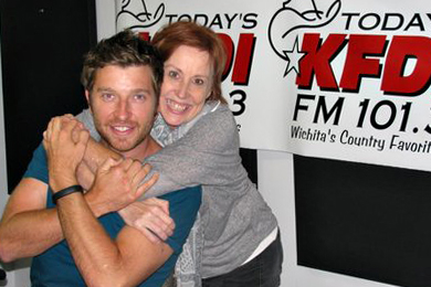 Atlantic/Warner Bros. artist Brett Eldredge (L) recently spent some time on air with KFDI MD Carol Hughes (R) promoting his latest single Beat Of The Music, which lands On Deck this week.