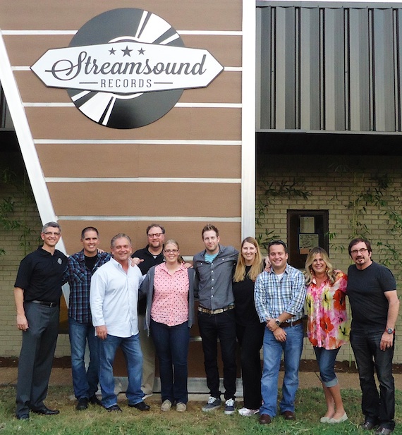 Streamsound Records executives and staff gather in front of their new offices. Pictured below L to R are: Steve Richardson (COO), Steve Pleshe (Regional), Mike Culotta (President), Eric Beggs (Regional), Mary McAllister (Office Coordinator), Tyler Waugh (Regional), Theresa Ford (Regional), Stan Marczewski (Regional), Cheri Cranford (Office Manager) and Byron Gallimore (CEO) 