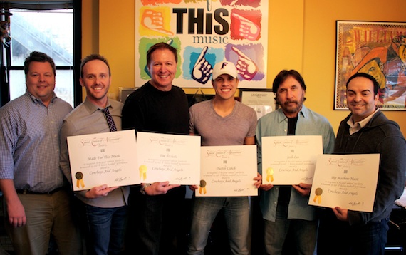 Pictured (L-R): BMIs Bradley Collins, This Musics Rusty Gaston, co-writer Tim Nichols, Dustin Lynch, co-writer Josh Leo, and Big Machine Musics Mike Molinar. Photo credit: Drew Maynard