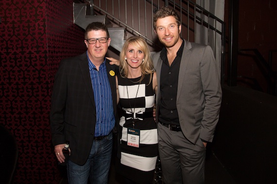 Pictured (L-R): WUSN PD Jeff Kapugi, Warner Music Nashville VP Promotion Kristen Williams and Atlantic/WMN artist Brett Eldredge.