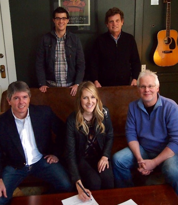 Pictured (seated, L-R): John Rolfe, Writer's Den attorney; Melissa Fuller;Bobby Rymer, Writer's Den partner. (standing, L-R) - Writer's Den writers Ben Cooper and Thom Schuyler.