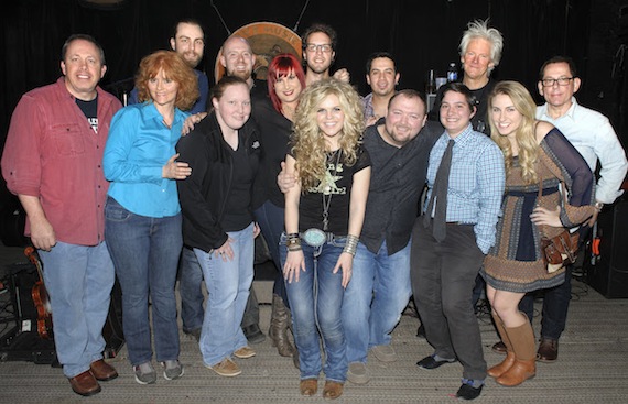 (L-R) WNOE's Don Gosselin and Mary Steele; the band's Joel Dormer; WNOE's Nina Hazard; the band's James Bavendam; WNOE's Jeanne LaCombe; the band's Zach Morse, Natalie Stovall and Miguel Cancino; WNOE's Brad Howell and Lindsey Luquette; HitShop President Skip Bishop; WNOE's Megan Parenti; and HitShop's Kim Stephens.