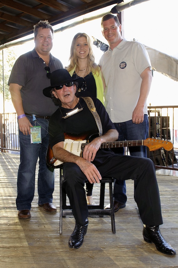 Pictured (L-R): BMIs Bradley Collins, Penny Everhard and Mark Mason pause for a photo with artist Tony Joe White (seated) at BMIs Howdy Texas party at Stubb's BBQ during SXSW on March 11, 2014, in Austin, TX. Photo: Erika Goldring.