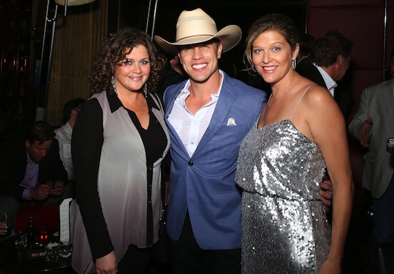 Pictured (L-R): Magic Mustang Publishings Juli Newton Griffith with singer Dustin Lynch and SESACs Shannan Hatch.