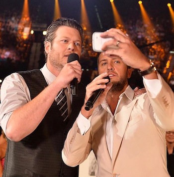 Selfie time! Co-hosts Luke Bryan and Blake Shelton search for the biggest stars in the roomdecide they are the biggest stars. 