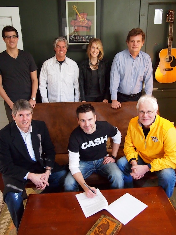 Pictured (L-R, seated): John Rolfe, Writer's Den attorney; Tom Worth; Bobby Rymer, Writer's Den partner. (L-R), standing) - Writer's Den staff writers Ben Cooper, Jerry Salley, Melissa Fuller and Thom Schuyler.