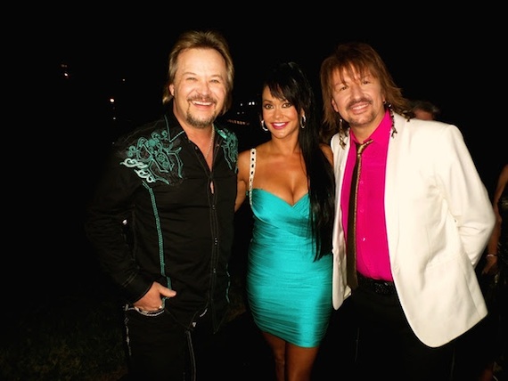 Pictured (L-R): Travis Tritt with wife, Theresa Tritt, and Richie Sambora of Bon Jovi. 