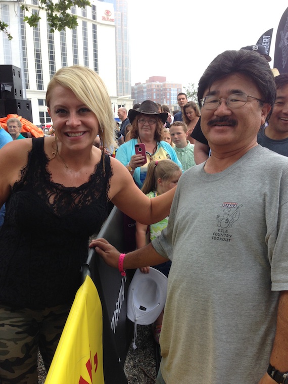 Gwen Sebastian (L) with a fan at CMA Music Festival.