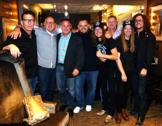     Pictured (L-R): Big Machine Records Erik Powell, Jack Purcell, The Oprys Pete Fisher, WSIXs Michael Bryan, The Cadillac Threes Jaren Johnston, Jarens father Jerry Johnston, Neil Mason and Kelby Ray.