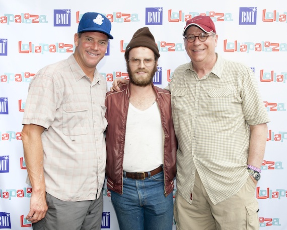 BMI Executive Director, Writer-Publisher Relations Mark Mason (left) and BMI Vice President, Writer-Publisher Relations Charlie Feldman (right) flank Fly Golden Eagles Ben Trimble backstage at Lollapalooza.