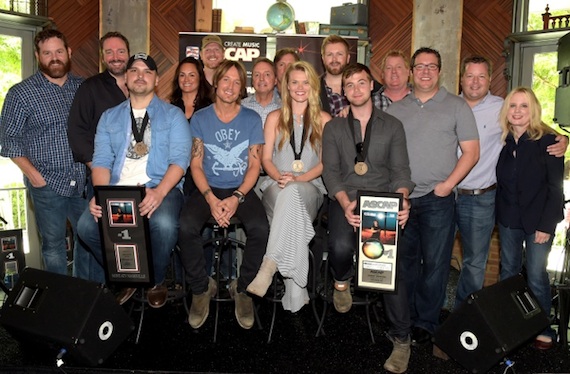 Pictured, Seated: Jon Nite, Keith Urban, Nicolle Galyon, Jimmy Robbins. Standing: UMG's Royce Risser,  Sony/ATV Tree's Josh VanValkenburg,  ASCAP's LeAnn Phelan, Producer Nathan Chapman, BMI's Jody Williams, UMG's Joe Fisher, Warner/Chappell's BJ HIll, ASCAP's Mike                  Sistad, Universal Publishing's Kent Earls, BMI's Bradley Collins and UMG's Cindy Mabe. Photo: Rick Diamond