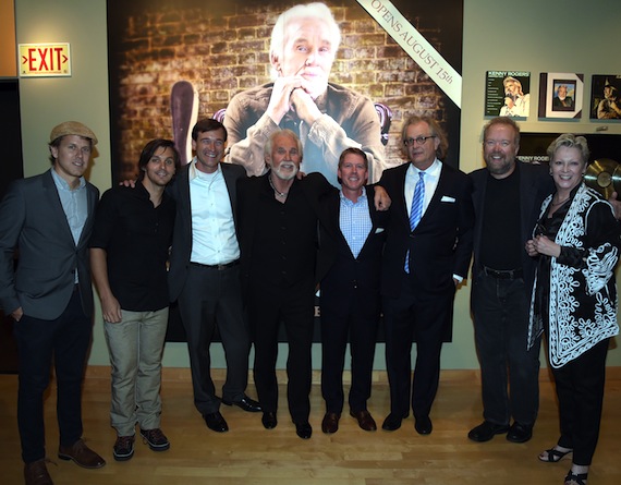 The Country Music Hall of Fame and Museum hosted a preview party on August 13 to celebrate the upcoming Kenny Rogers: Through the Years exhibit, opening Friday, August 15. The new exhibit, presented by SunTrust, incorporatesawards, costumes, sheet music, memorabilia, and more. Pictured at the exhibit preview are (l-r): Matt Glassmeyer, Charlie Worsham, SunTrust's Andrew Kintz, Kenny Rogers, SunTrust's Earle Simmons, The Country Music Hall of Fame and Museum's Kyle Young, Don Schlitz, and the Country Music Hall of Fame and Museum's Carolyn Tate.