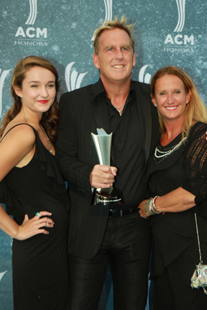 Brian OConnell (c) with family, presented his sixth Promoter of the Year statuette. Photo: Bev Moser.