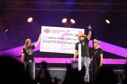 Photo (L-R): Tina Binson (Komen Detroit Planning Committee member and sponsor), Aldean and Denise Stewart (survivor and Komen Southwest Michigan Development Director). Photo: Loreen Sarkis/Getty Images