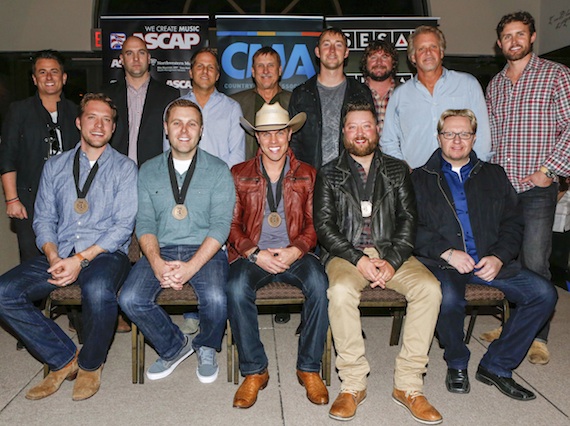 Pictured (L-R, front row): ASCAP co-writers Matt Jenkins and Zach Crowell, Dustin Lynch, SESAC co-writer Cary Barlowe, producer Mickey Jack Cones. (back row): Major Bob Music's Jesse Frasure, ASCAP's Robert Filhart, Broken Bow's Jon Loba, SESAC's John Mullins, Tape Room Music's Ashley Gorley, Combustion Music's Chris Van Belkom and Chris Farren, and Warner/Chappell Music Publishing's Ryan Beuschel. Photo: Ed Rode.  