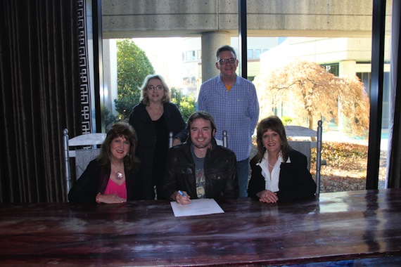 Pictured (L-R): Seated: Debbie Moore, James Carothers, Carrie Moore-Reed. Standing: JoAnn Berry (Manager) and Perry Howard (BMI Director,Writer/Publisher Relations)