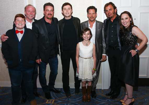 Pictured (L-R): Thomas (a Make-A-Wish child); Joey Hemphill, Chairman & Treasurer, Hemphill Brothers Coach Company and Make-A-Wish Board Member;  Rob Beckham, Co-Head, WME Nashville and Make-A-Wish Board member; Scotty McCreery; Jessica (a Make-A-Wish child); Gary Allan; Jonathan Cain; and Beth Torres, President & CEO, Make-A-Wish Middle Tennessee.  