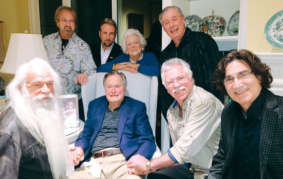 Pictured (L-R) front: William Lee Golden, President George H.W. Bush, Joe Bonsall and Richard Sterban. Standing: Duane Allen, Darrick Kinslow, Barbara Bush & Darrell Bowling).