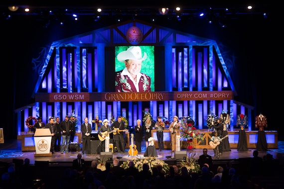 Artists gather at the end of the celebration of life ceremony to honor Little JImmy Dickens onstage at the Grand Ole Opry House.