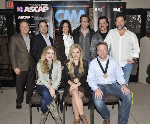 Pictured (L-R): (front row) Maddie & Tae with co-writer Aaron Scherz, (back row) BMI's Jody Williams, Big Machine Music's VP Publishing Mike Molinar, ASCAP's LeAnn Phelan, producer Dann Huff, Big Machine Label Group President & CEO Scott Borchetta and Dot Records General Manager Chris Stacey. Photos by Frederick Breedon. 