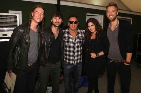 In July 2012 Lady Antebellum took a break from the European leg of their headlining world tour to open for Bruce Springsteen in Londons Hyde Park. (L-R): Jason Gambill (guitar, Lady Antebellum), Dave Haywood, Bruce Springsteen, Hillary Scott and Charles Kelley. Photo: Adam Boatman